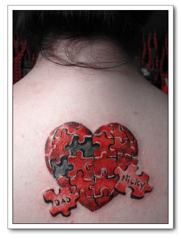 Royalty-free love clipart picture of a red heart tattoo background with a